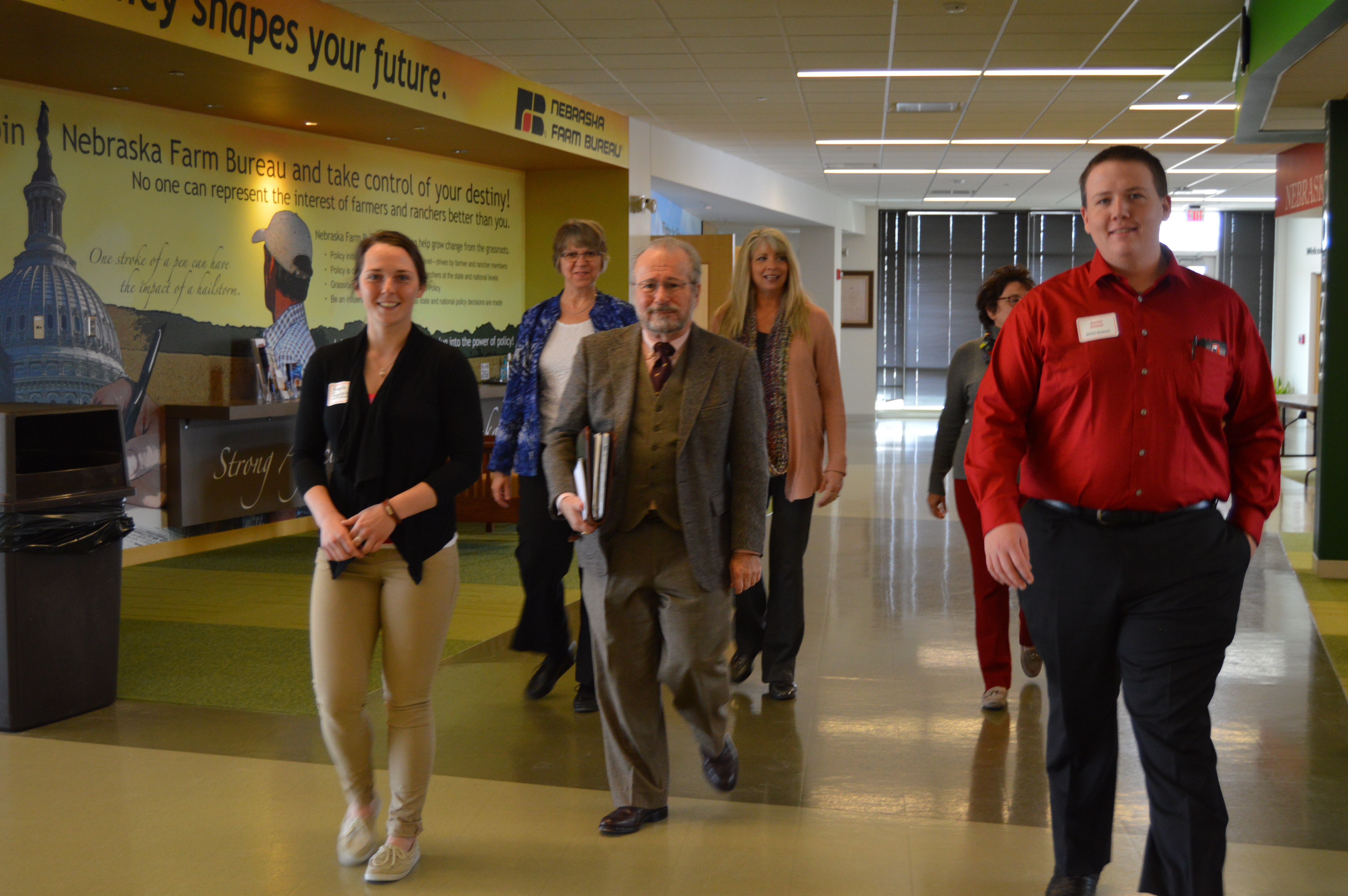 NCTA students Kayla Reynolds, left, and Aaron Jensen, right, lead HLC team reviewers at NCTA’s Nebraska Agriculture Industry Education Center. (Crawford/NCTA photo)