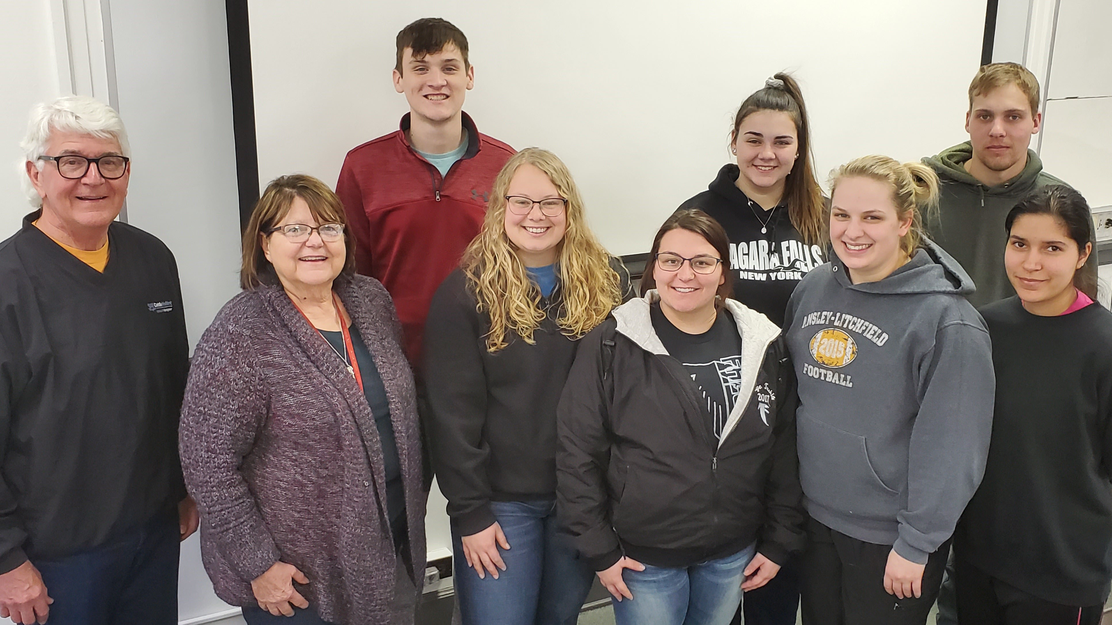 Seven NCTA Agribusiness Management students gather for an entrepreneurship class in February with guest speaker Chuck Schroeder of Lincoln, far left, and Professor Mary Rittenhouse, second left. (Crawford / NCTA News photo)
