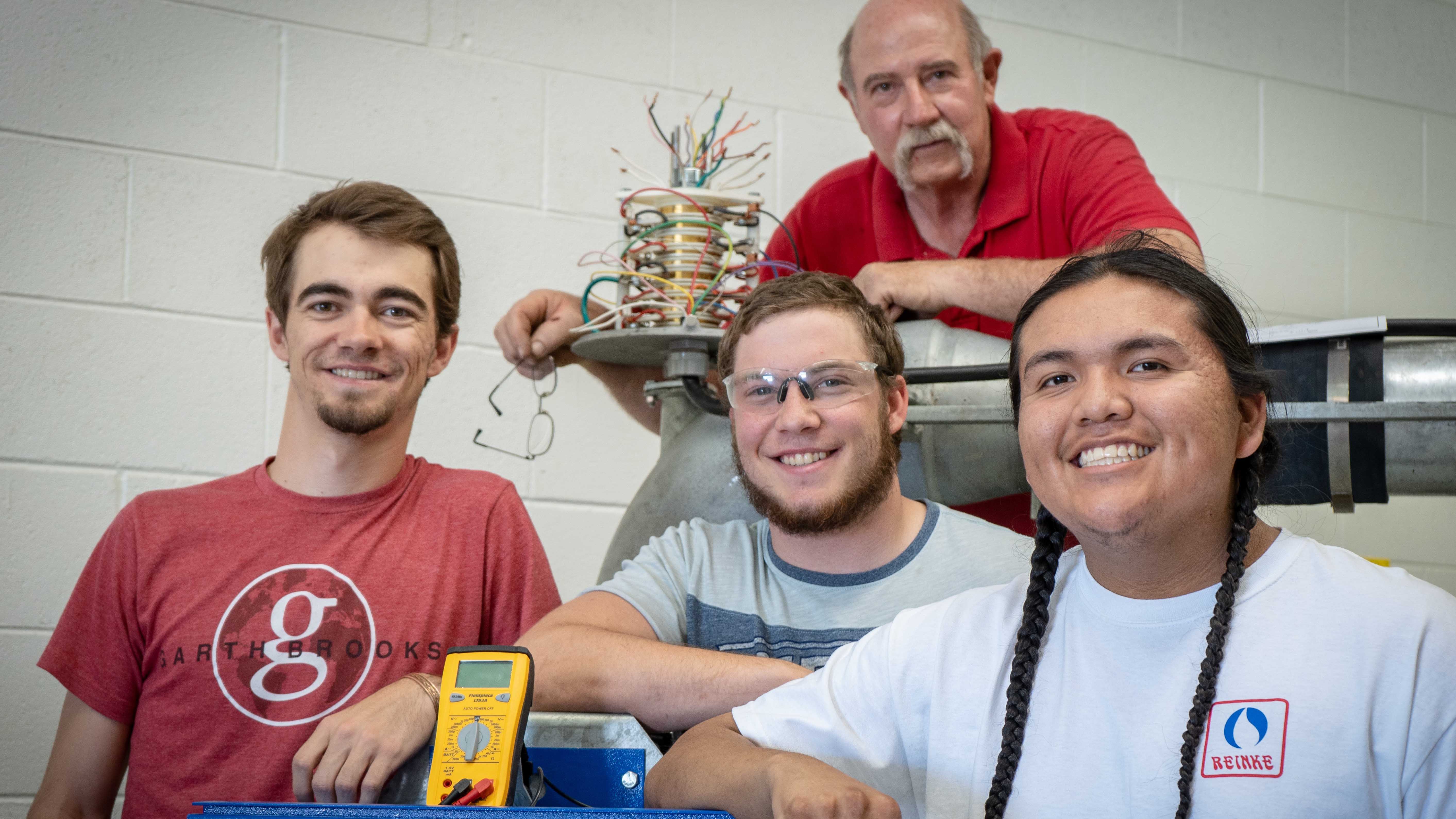 Irrigation technician students studying at the Nebraska College of Technical Agriculture in April, 2019, with their instructor Dan Stehlik, are from left, Clancey Smith of Nebraska, Troyal Burris of Kansas and Kolton Begay of Colorado. NCTA was recognized in June with two awards for Outstanding Postsecondary Programs in Nebraska organizations. (Cy Cannon / NCTA photo)