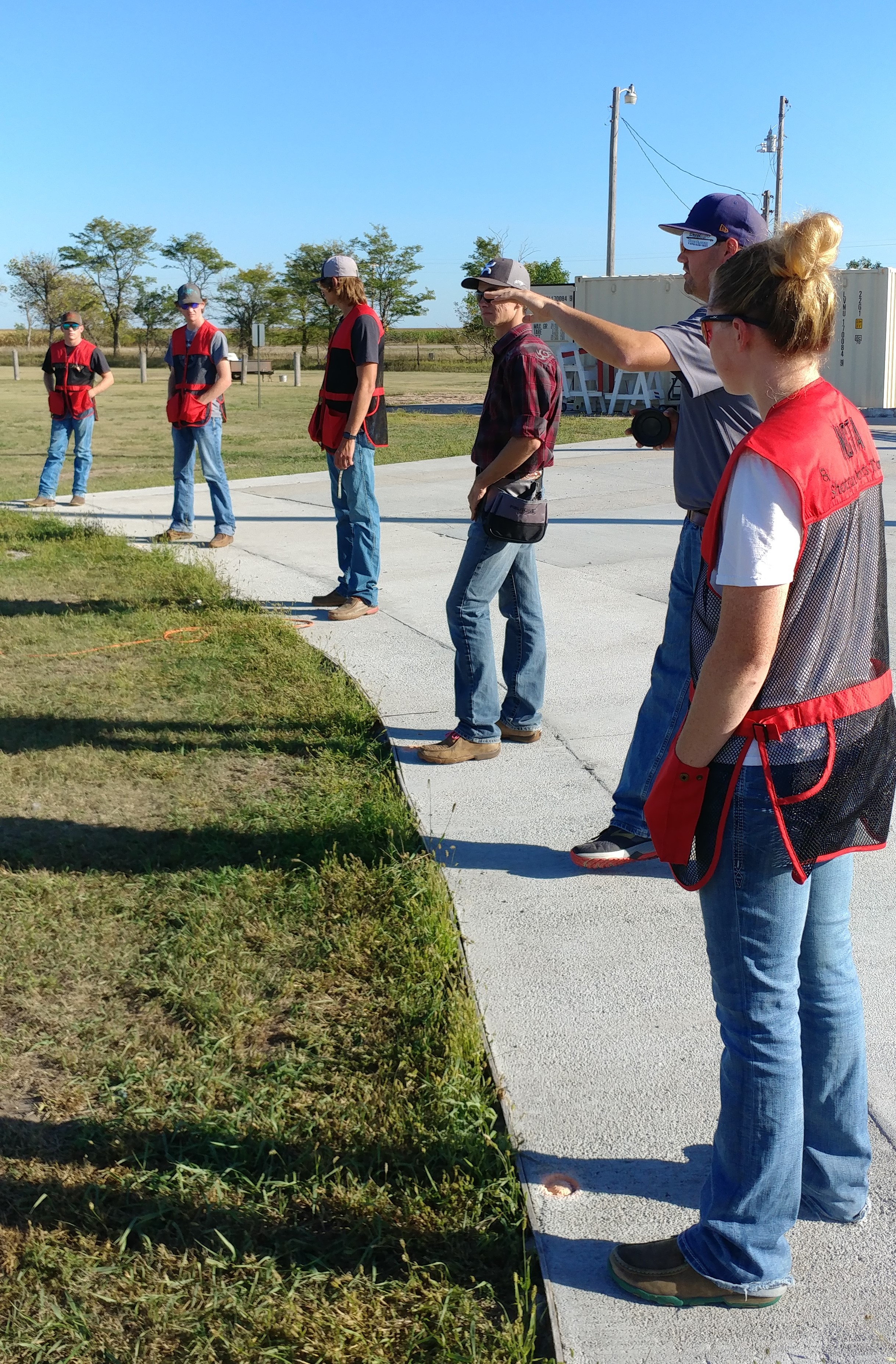 The Aggie Shooters receive trap shooting tips from Britt Dalton, who was helping the trap squad at a recent workout. (Mary Crawford/NCTA News)