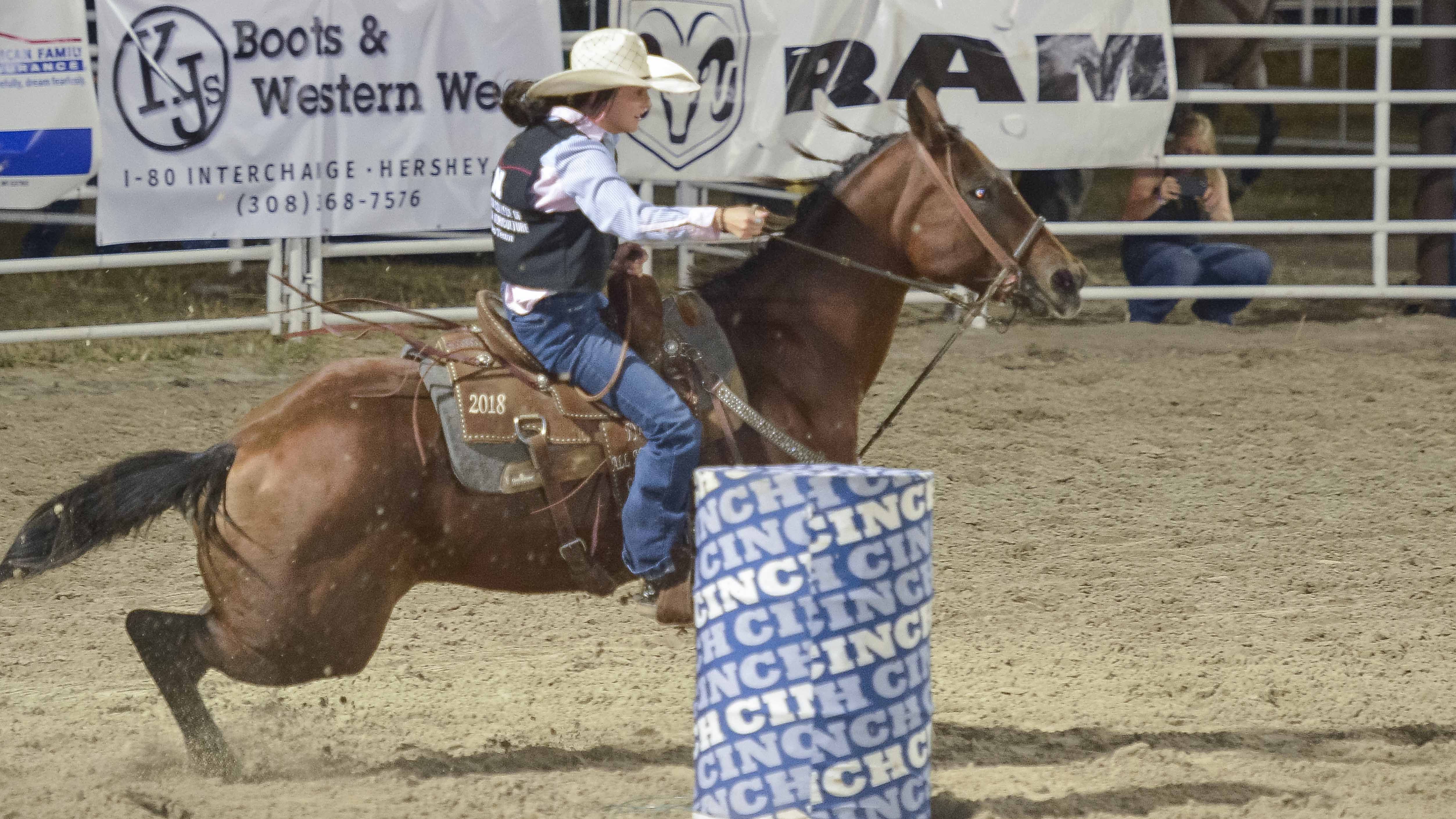 Aggie Ellie Stohlmann competed in barrel racing at collegiate rodeos this fall including at the North Platte Stampede in September. (George Hipple photo for NCTA)