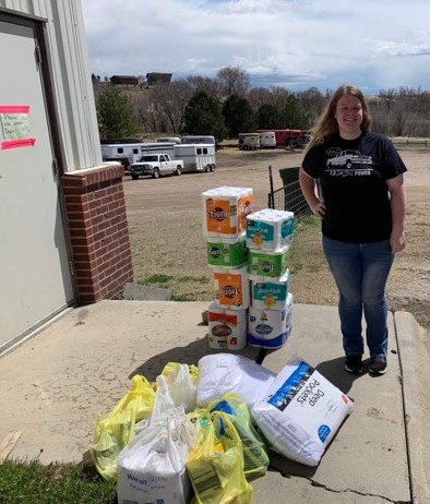 Emily Giese of Papillion, a diversified agriculture student at the Nebraska College of Technical Agriculture in Curtis, and member of Women in Agriculture, prepares to load disaster donations Friday morning. WIA faculty advisor Meredith Cable is delivering supplies on behalf of the NCTA WIA Disaster Relief project. Many of these supplies were donated by a church in Gothenburg. (Photo by Jocelyn Kennicutt / NCTA News)