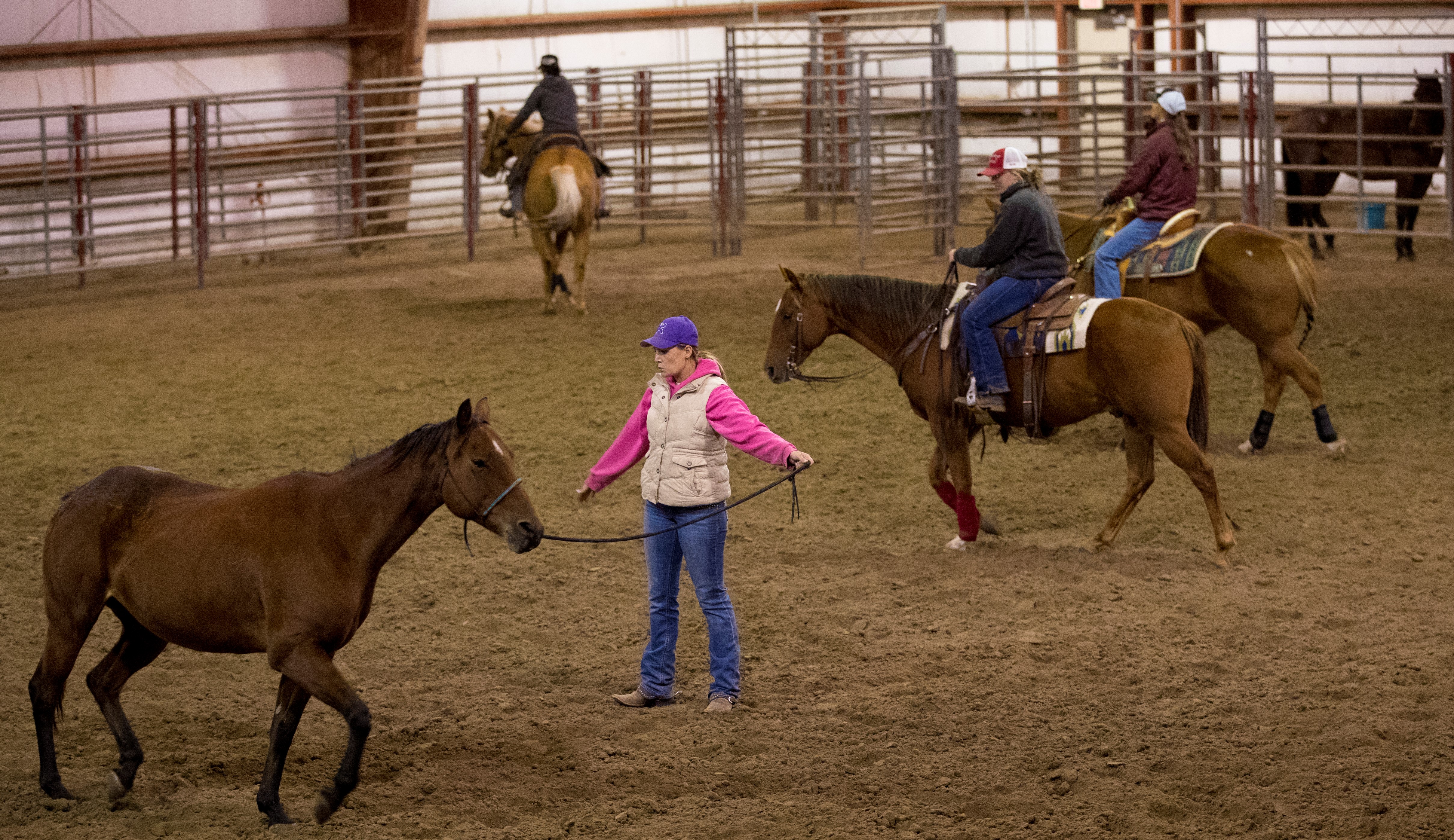 Equine management and Ranch Horse Team students at the Nebraska College of Technical Agriculture work their horses in the indoor arena at the Livestock Teaching Center at the Curtis campus. (NCTA Photo by Craig Chandler / University Communication.)