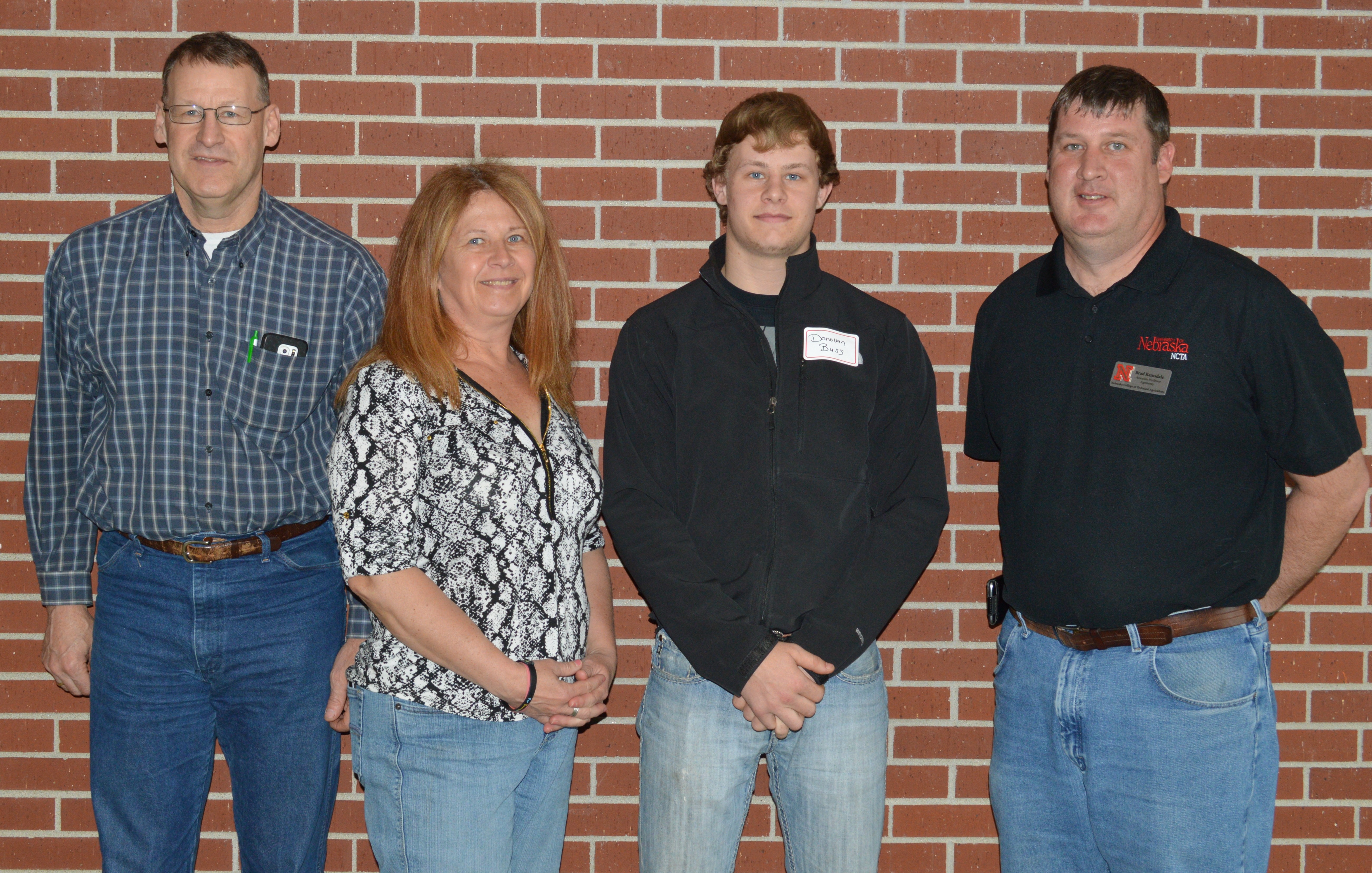 Donovan Buss and his parents, Bryan and Diane (at left), met with Brad Ramsdale, NCTA agronomy professor, during a campus visit. Buss graduated in May from York High with a college certificate. (NCTA Photo)