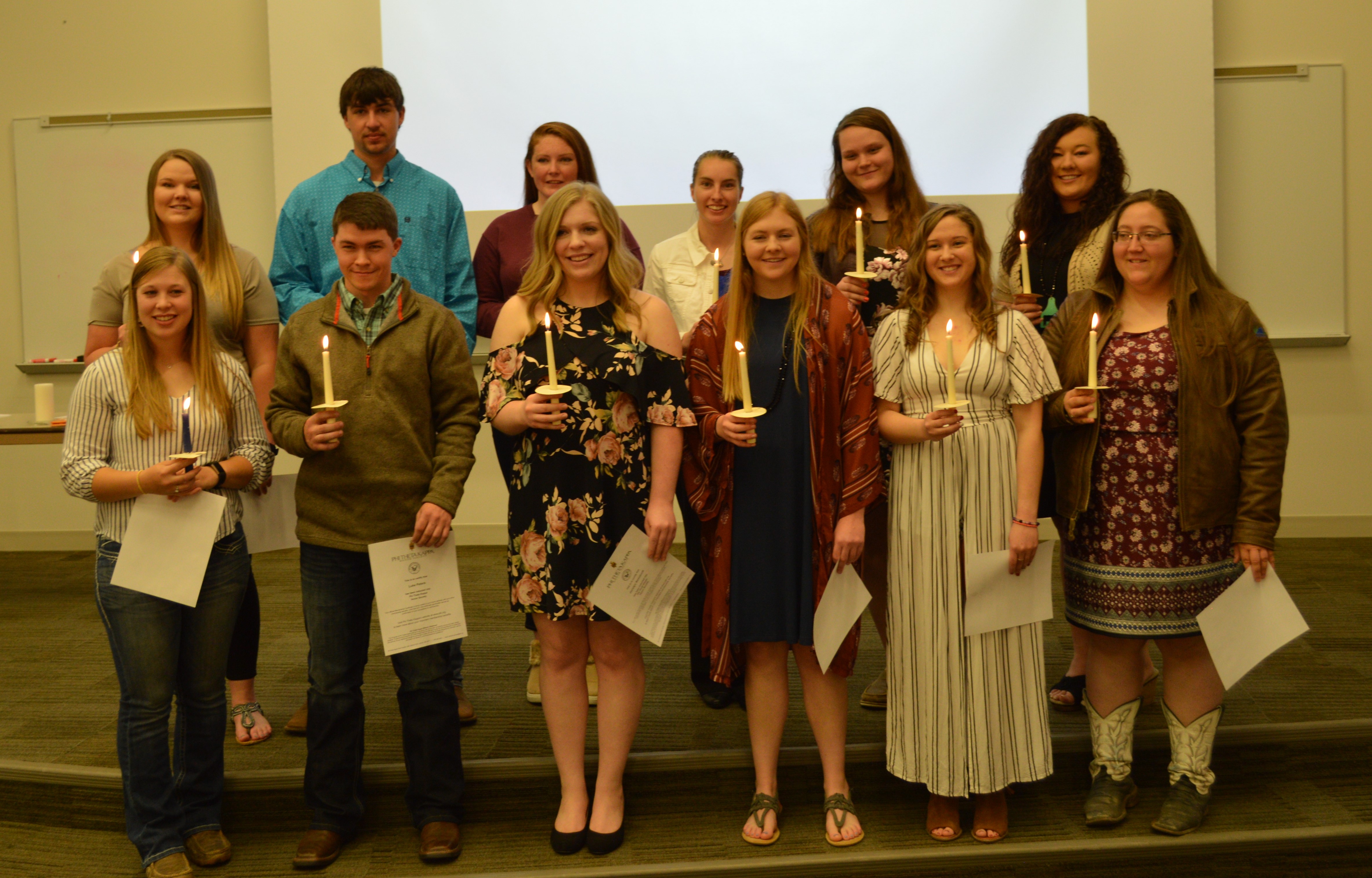Inductees present for initiation to Phi Theta Kappa at the Nebraska College of Technical Agriculture, Curtis included front, from left: Kelly Gordon, Luke Peters, Jocelyn Kennicutt, Emily Riley, Aurora Urwiler and Alexis Penna. Back row, Morgan Curran, Dean Fleer, Kaylee Hostler, Catherine Ljunggren, Amanda Schmidt, and Kayla Mues. (E. Griffiths / NCTA Photo)