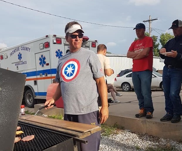 Kevin Martin grills burgers at an NCTA thank you picnic for EMS volunteers who gathered Monday night at the Curtis fire hall. (NCTA photo)