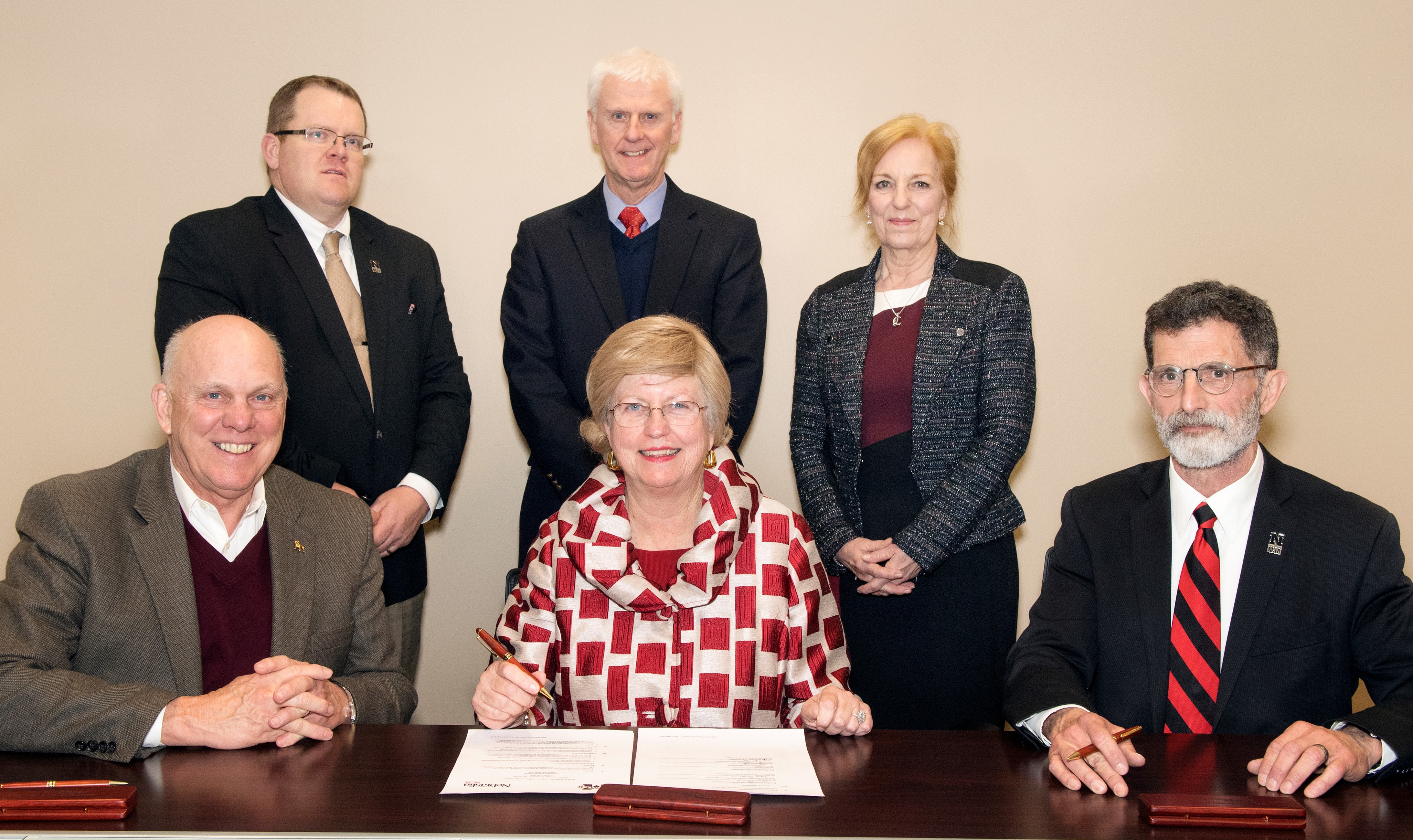 Attending the NCTA-MSU partnership signing are, (seated, left to right) George Hopper, dean of MSU's College of Agriculture and Life Sciences; Judy Bonner, MSU provost and executive vice president; and Ron Rosati, NCTA dean. (Standing, from left) Professor Doug Smith, chair of NCTA Animal Science and Agricultural Education; Peter Ryan, MSU associate provost for academic affairs; and Professor Mary Beck, head of MSU's Department of Poultry Science. (Photo by Beth Wynn/MSU)