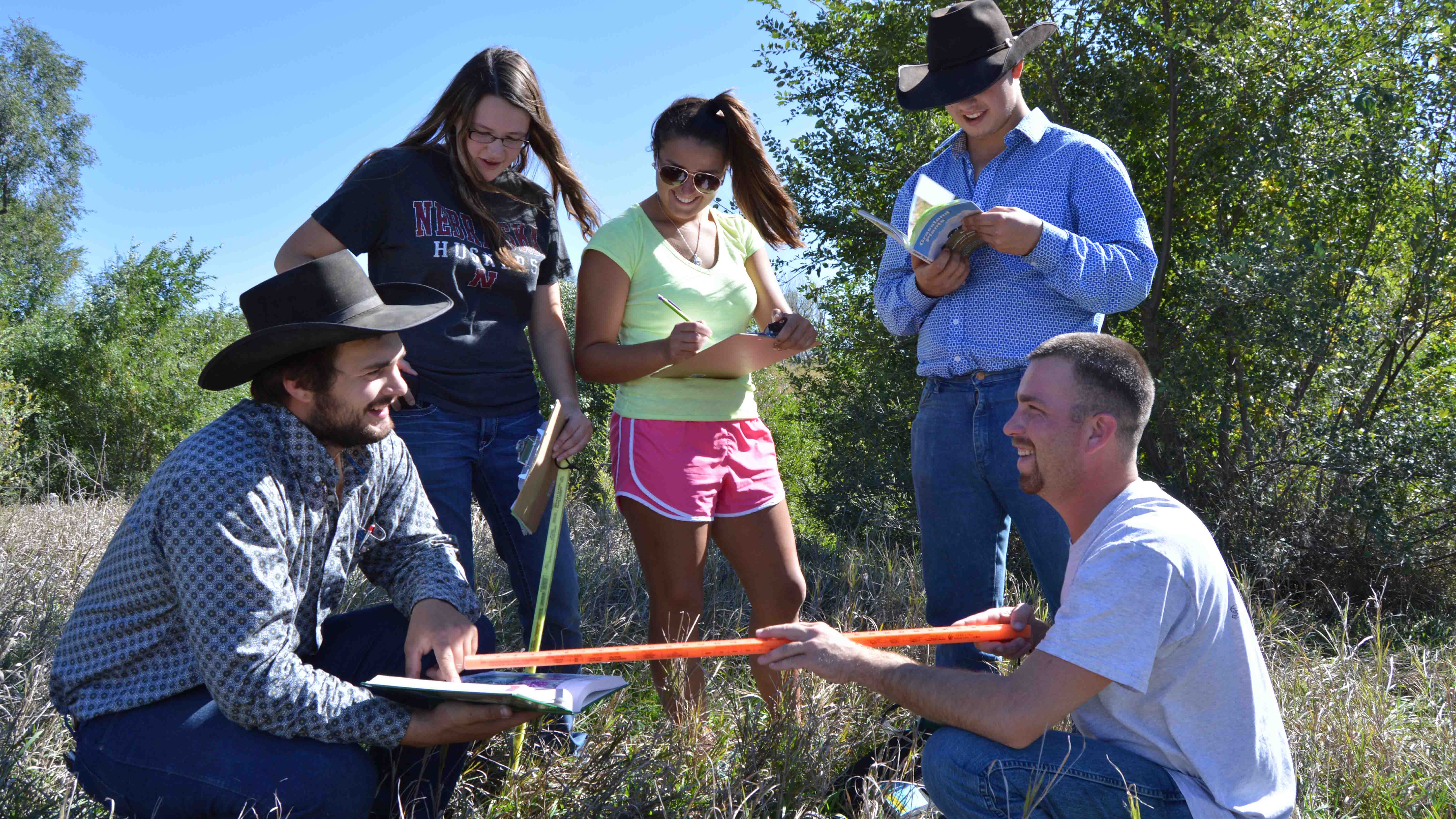 NCTA students measure plant density in a rangeland class. (NCTA file photo)