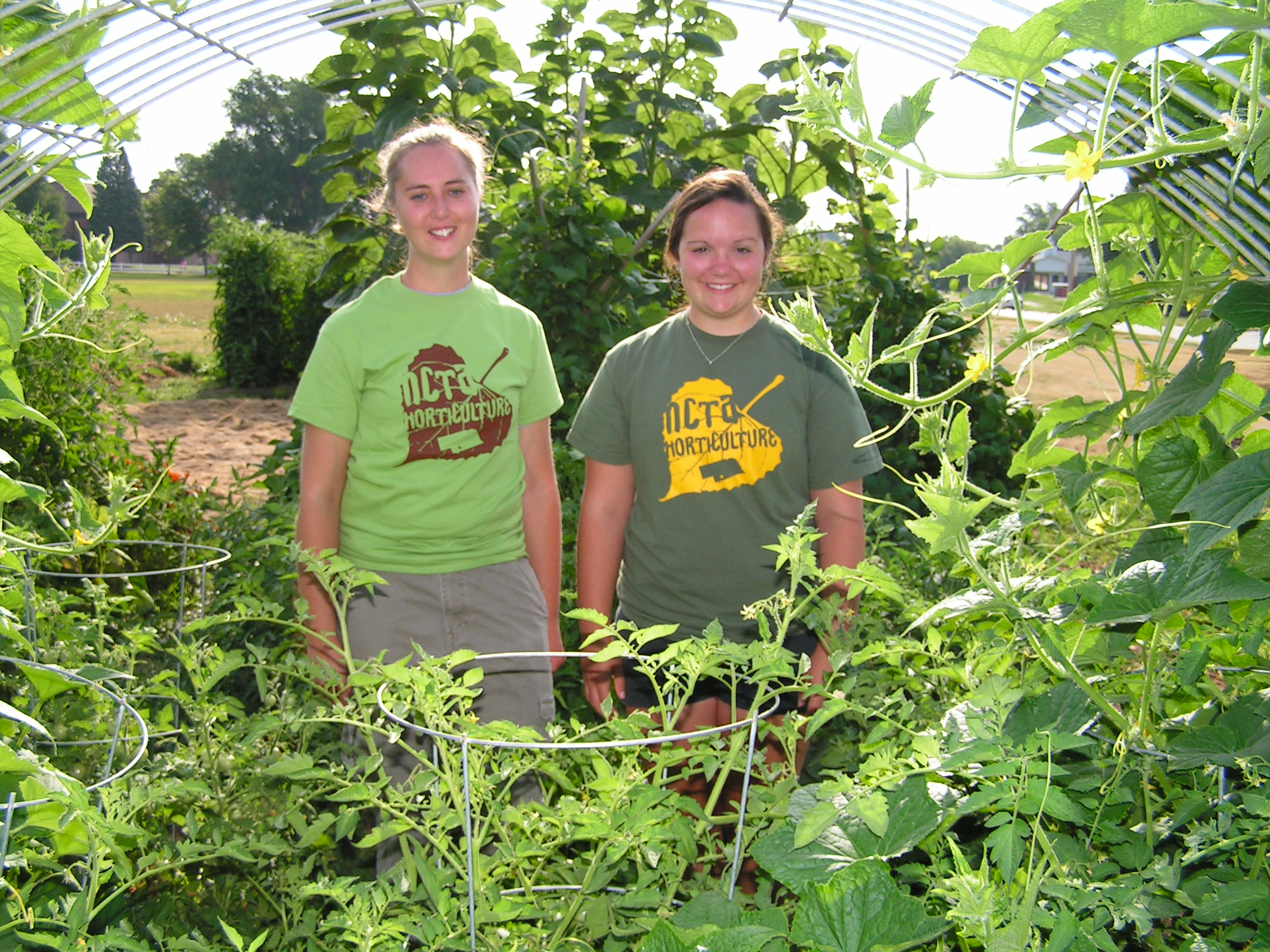 The NCTA Horticulture Club is hosting a plant sale at the campus greenhouse in Curtis on April 30 and May 5. Tee Bush and Regan Garey, both of Curtis, at the community garden in 2014. (NCTA News photo)