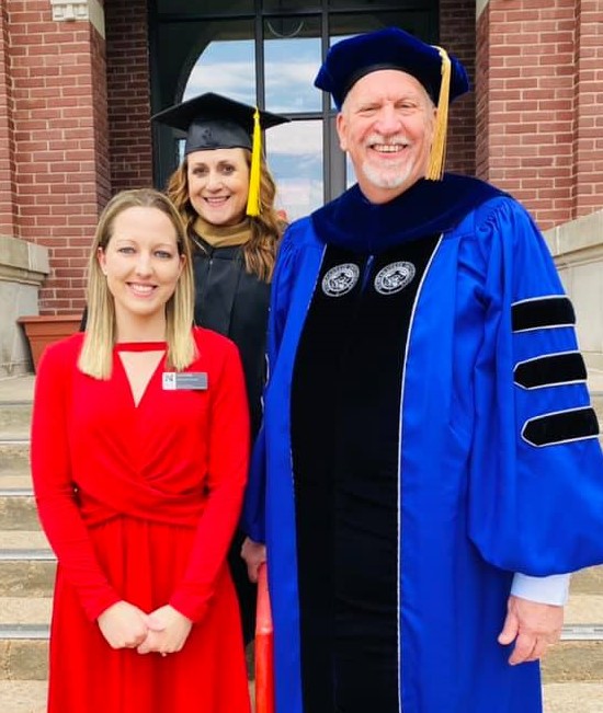 Josi Arnold, recipient of the IANR Inclusive Excellence Award, often lends a helping hand to students and staff at NCTA. Campus deans Jennifer McConville and Larry Gossen joined Arnold at steps of Ag Hall for the outdoor commencement in May. (NCTA Photo)