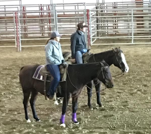 NCTA Ranch Horse team members Whitney Hall of Alliance and Shane Hoer of Blair  gain horsemanship pointers from clinician Sherman Tegtmeier. (NCTA photo)