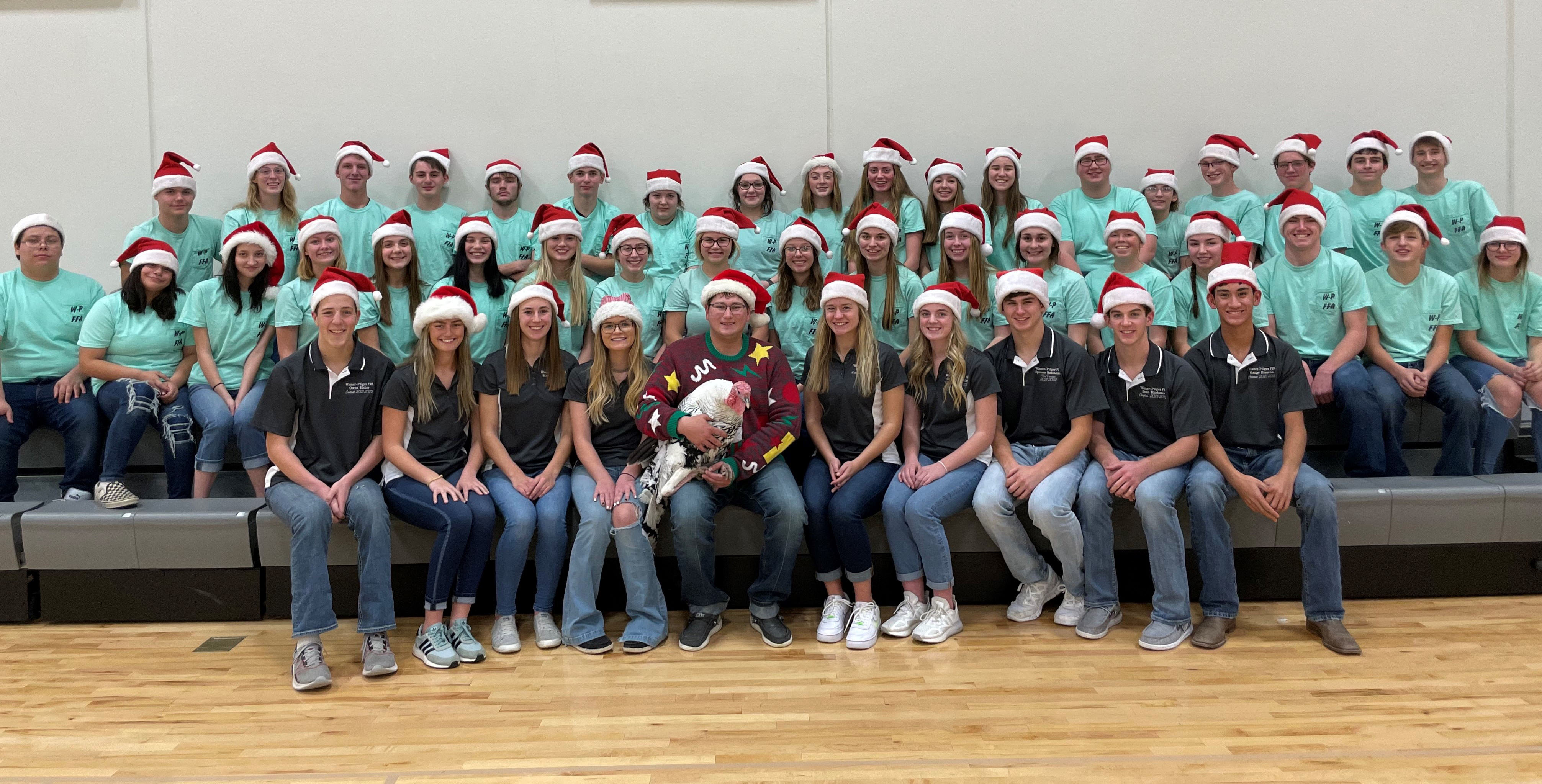 FFA Advisor Wade Overturf, center front, gathered members of the Wisner-Pilger FFA Chapter for a festive holiday scene. (Courtesy photo)