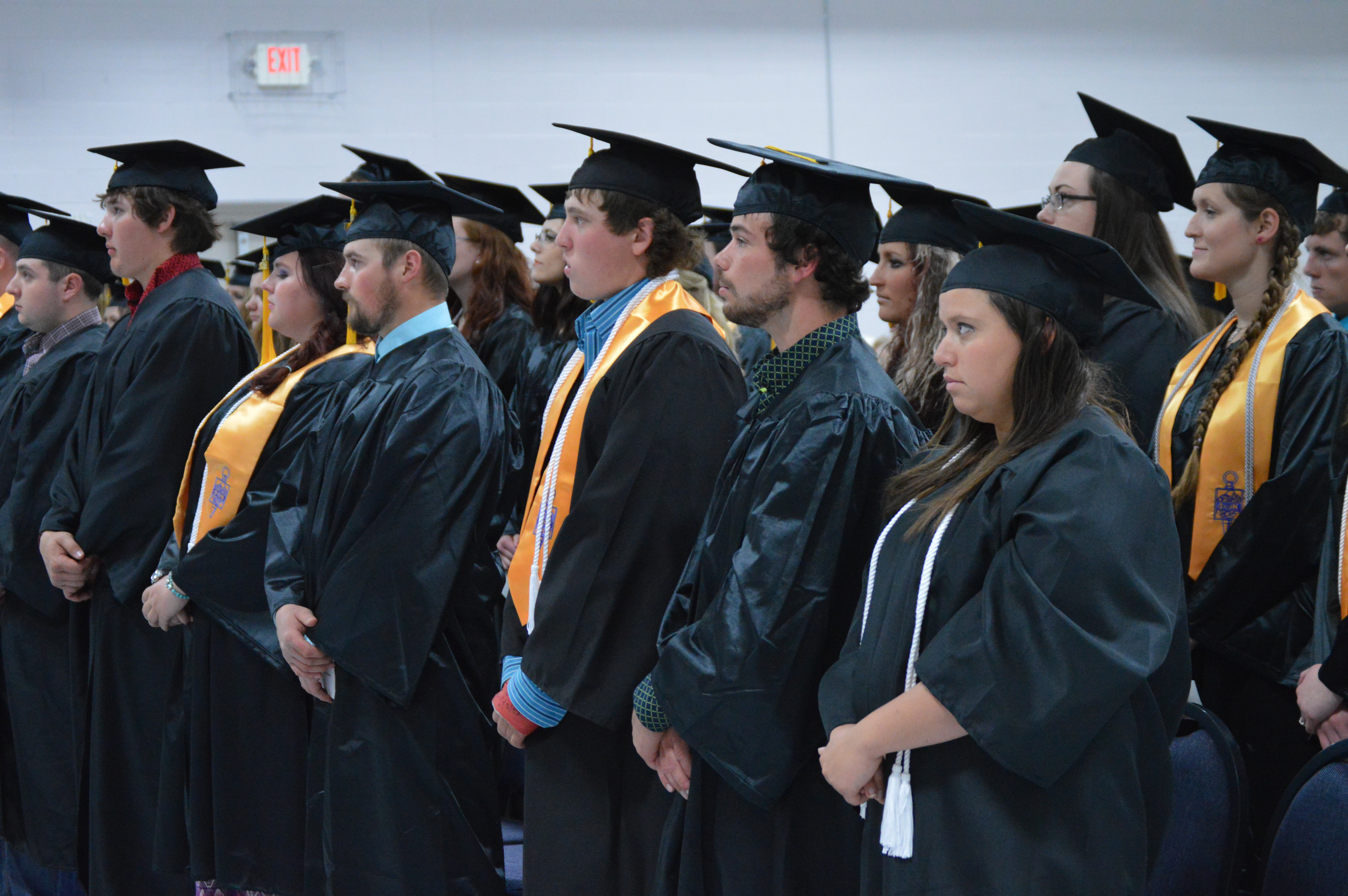 NCTA Class of 2016 graduates rise to move their tassels on their mortarboards from right to left. Governor Pete Ricketts was a keynote speaker for the May 5 commencement in Curtis. (NCTA photo)