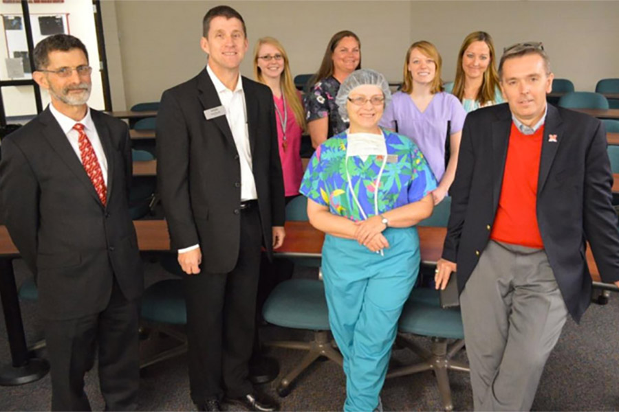 NCTA Dean Ron Rosati, at left, and Veterinary Technology Division Chairman Barbara Berg, center, join NCTA Vet Tech staff and students in hosting NU administrators Hank Bounds and Ronnie Green during a campus visit in April, 2015.