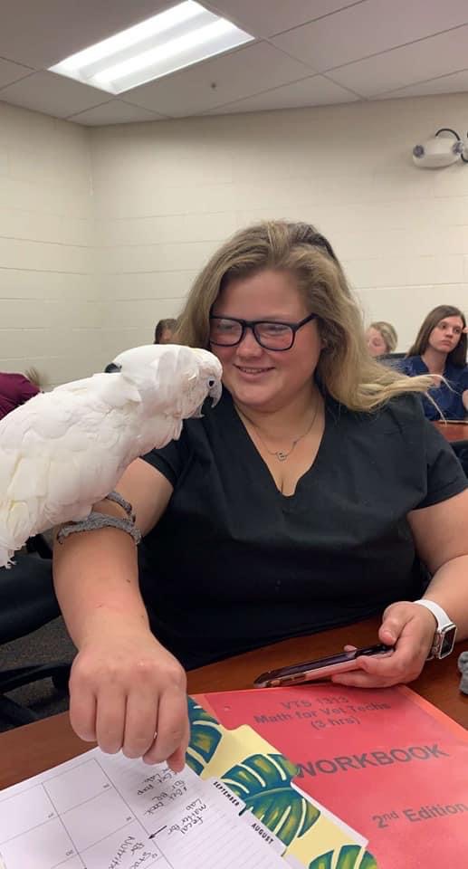 Vet tech student talking to the birds 