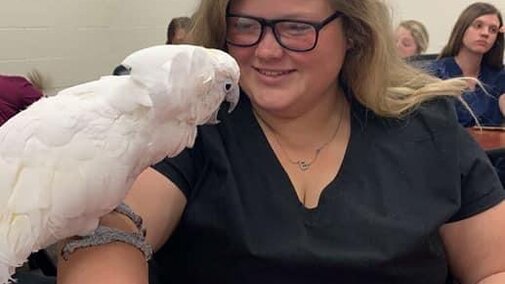 Vet tech student talking to the birds 