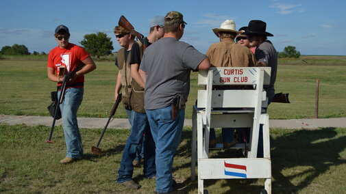 Aggie shooters confer on practice scores at the Curtis Gun Club. Their first contest starts Friday with a three-day match near North Platte.(C.Tilford/NCTA photo)
