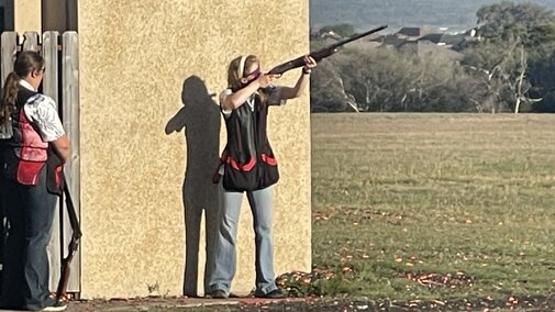 NCTA student, Hannah, competing at shotgun team event.
