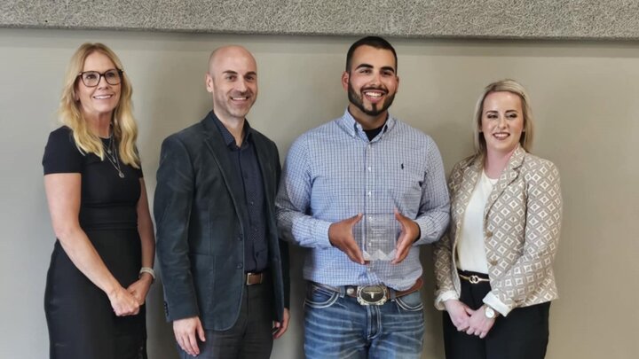 Morel Jurado pictured with his Farmworker of the Year award.