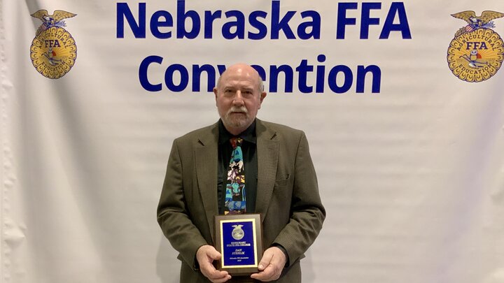 NCTA agriculture mechanics instructor Dan Stehlik photographed at the Nebraska FFA Convention with Honorary State FFA Degree.