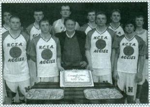 Aggies of 2003-2004 join Coach Del Van Der Werff after his 400th win. (The Aggie yearbook archives)