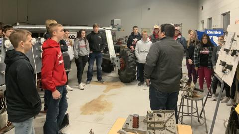 Sophomores from Pleasanton High School tour the NCTA campus with Rulon Taylor, recruiter. In the Ag Mechanics lab they see a center pivot tower built by irrigation technician students who also study welding and electricity. (Photo by Andela Taylor / NCTA)