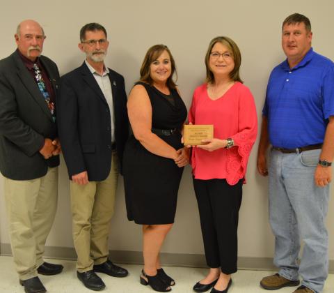The Aggie Alumni Association at NCTA recognized Reinke Manufacturing Co., Inc., with its Alumni Service Award. Sandi Reinke Wendell is joined by, from left, Dan Stehlik, ag mechanics instructor; Dean Ron Rosati, Associate Dean Jennifer McConville, and Brad Ramsdale, chair, Agronomy and Agricultural Mechanics.