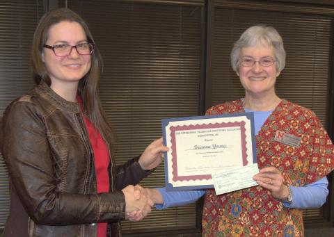 Brianna Young accepts her scholarship from NCTA Professor Ricky Sue Barnes, DVM. (Hauptman/NCTA News photo)