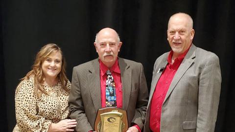 Dan Stehlik is congratulated by NCTA Associate Dean Jennifer McConville and NCTA Dean Larry Gossen after receiving the 2021 Outstanding Postsecondary Agricultural Program Award from the National Association of Agricultural Educators. (Courtesy photo)