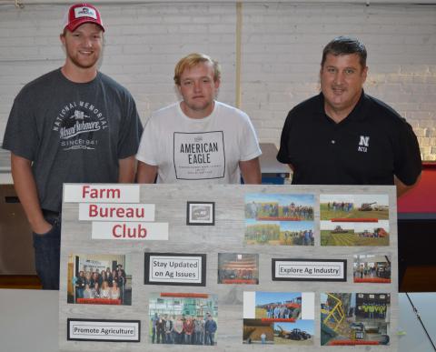 The NCTA college fair for clubs and organizations included the Collegiate Farm Bureau Club. (L-R) Clade Anderson of Otis, Kansas, Chase Callahan of Gothenburg and Professor Brad Ramsdale shared goals of the club to promote agriculture, stay updated on ag issues, and explore the ag industry. (Crawford/NCTA News photo) 