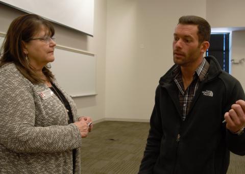 Wade Shipman discusses an agricultural finance seminar with Mary Rittenhouse, division chair of NCTA Agribusiness Management Systems. (Crawford, NCTA News)