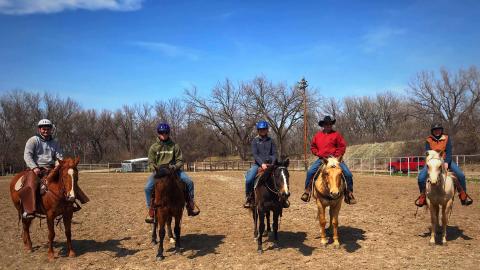 Six Aggie students completed their final “exam” over the weekend by riding a colt they trained in the college class. From left, CJ Monheiser, Nathan Burnett,  Addy Villwok, instructor Steven Mueller, and Lillyanne Lewis. Not shown are Rose Siebenaler and Abby Anderson. (Photo by Joanna Hergenreder)