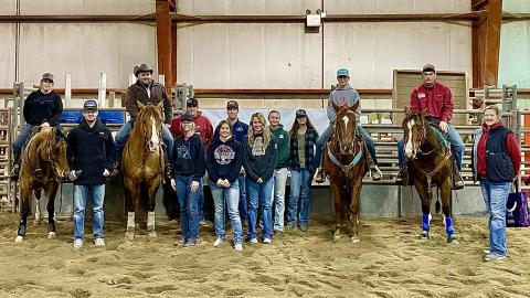 Joanna Hergenreder (standing far right) and the NCTA Ranch Horse Team students hosted Sherman Tegtmeier (on horseback 3rd from left) in Curtis.