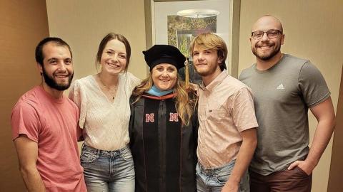 Jennifer McConville's four children gathered August 13 to see her receive a doctorate in education from the University of Nebraska-Lincoln. (McConville photo)