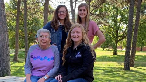 Recipients of the Glenn Jurgens Scholarship gathered last fall at the NCTA Veterinary Technology complex with Pam Jurgens of Curtis. Seated with Pam is Jenna Garver, joined by Anna Whyman, standing at left, and Tiffany Dickau, who will graduate in December. (Photo by Annie Basset / NCTA News)
