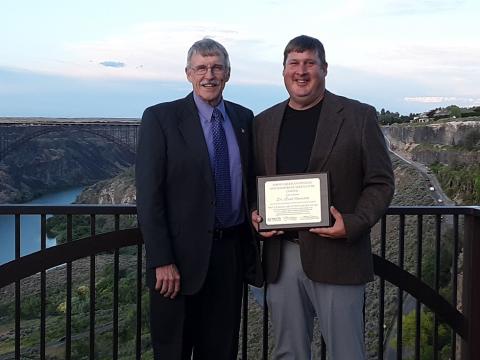 Dr. Brad Ramsdale (right) NCTA agronomy professor and crops team coach, received a national judging and student service award this summer at Twin Falls, Idaho, shown with Dr. Kevin Donnelly, who nominated him.