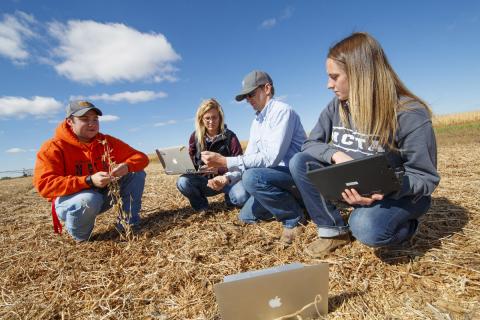 Students at the Nebraska College of Technical Agriculture in Curtis evaluate crop residue at the campus farm.Two of these NCTA graduates are pursuing a 4-year degree at the University of Nebraska-Lincoln. (Craig Chandler / NCTA photo)