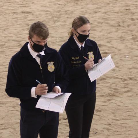  FFA members mark their livestock judging scorecards in Career Development Events at NCTA. (Emily Grote / NCTA photo)