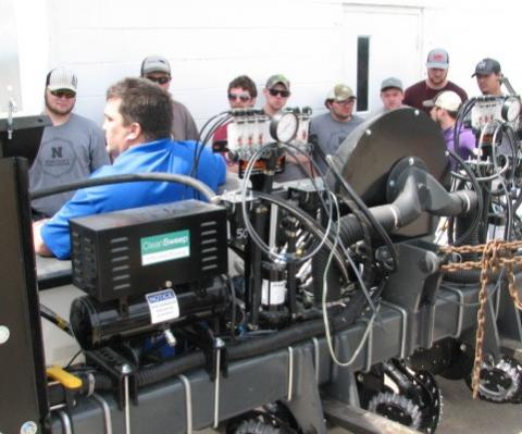 NCTA alumnus Anson Nielsen of Minden describes a new 6-row planter to NCTA students when he delivered it to campus in April. (NCTA Photo)