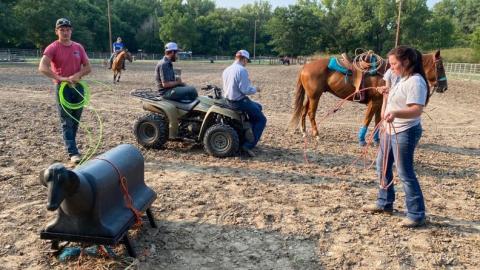 NCTA Aggie Rodeo athletes warm up with a roping dummy at Mill Park in Curtis before riding horseback. The Aggies are hosting a 10-week Round Robin Team Roping series each Tuesday at 6:30 p.m. (Photo by Annie Bassett / NCTA News)