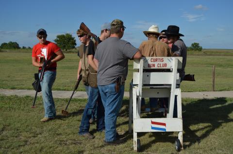 Aggie shooters confer on practice scores at the Curtis Gun Club. Their first contest starts Friday with a three-day match near North Platte.(C.Tilford/NCTA photo)