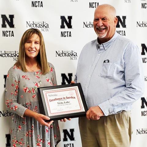 Vicky Luke receives the Excellence in Service Award from NCTA Dean Larry Gossen. (J. McConville photo)
