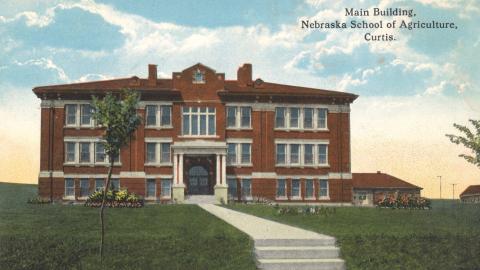 Aggie alumni can see updates to the original NSA structures. This postcard image shows Agriculture Hall built in 1912, and at right, the Ag, Land and Water Conservation building built in 1914. (Courtesy of Andela Taylor / NCTA)
