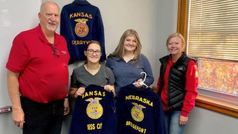 NCTA Dean Larry Gossen hosted a reception for 2022 recipients of the FFA American Degree who are students at the Nebraska College of Technical Agriculture in Curtis. Gossen’s jacket from Cherryvale, Kansas hangs behind him. He is joined by Aggie students, from left, Caitlin Smee, Ness City, Kansas FFA; Aleena Wagner, Bridgeport FFA and Gwen Olberding of Falls City FFA. (Andela Taylor photo / NCTA)
